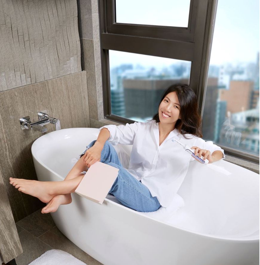 Beauty, Skin, Bathtub, Room, Leg, Plumbing fixture, Sitting, Comfort, Bathroom, Interior design, 