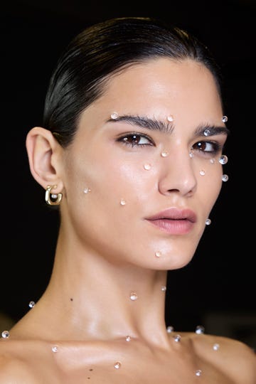a woman with a lot of bubbles on her face