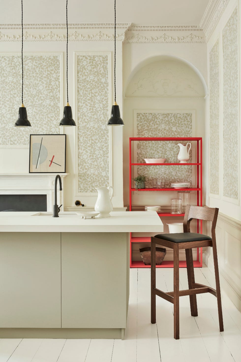 Kitchen with neutral floral wallpaper and wooden stool