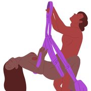 a standing position penetrator stands to enter receiver is seating in a doorway mounted sex swing with legs wrapped around partners waist