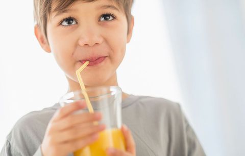boy drinking orange juice