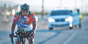 race across america cyclist fueling with an energy gel
