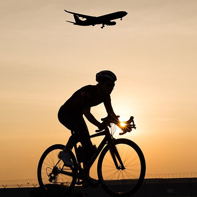 cyclist airport airplane dawn