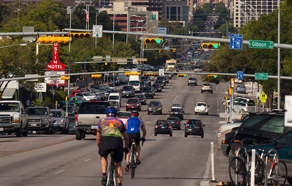 cyclists ride through downtown austin texas