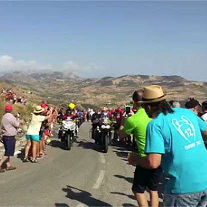 Cop Pushes Man In Front of Motorcycle at Vuelta