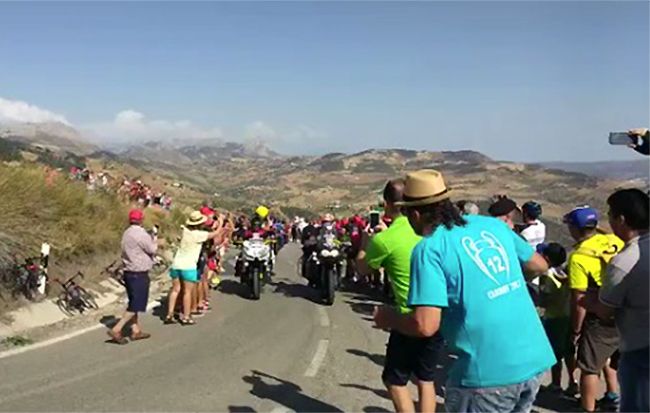Cop Pushes Man In Front of Motorcycle at Vuelta