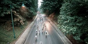 group of riders cruise through the forest at the whistler gran fondo