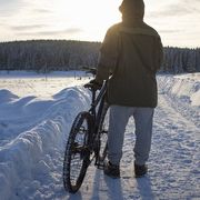 cyclist watching winter sunset