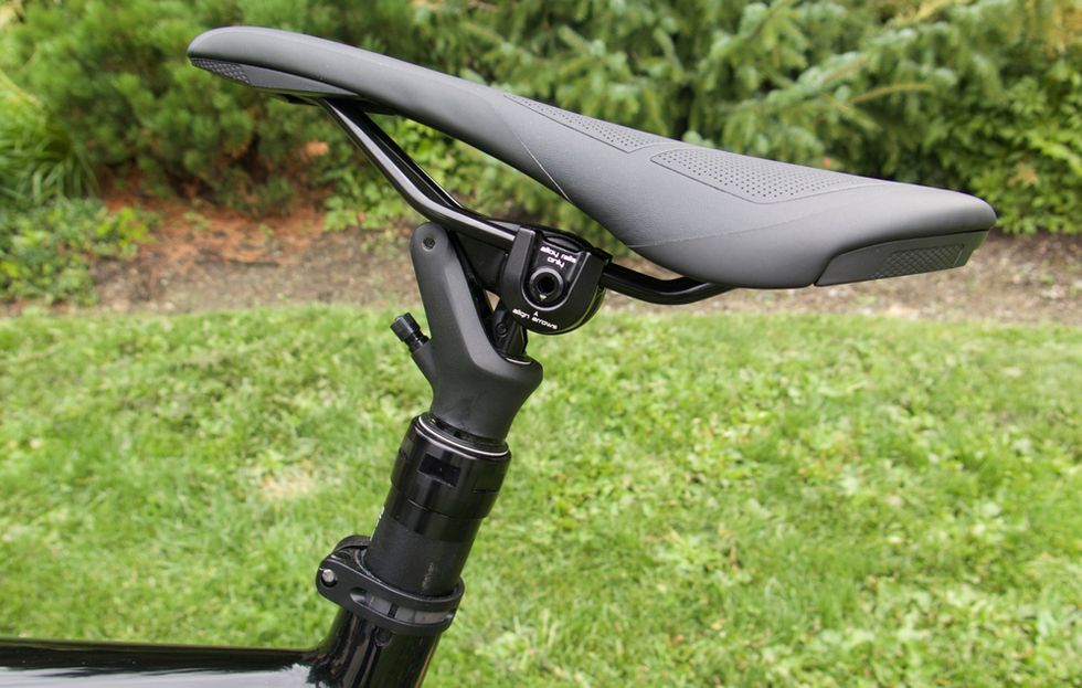 Bicycle part, Bicycle saddle, Vehicle, Bicycle handlebar, Bicycle, Bicycle frame, Grass, Mountain bike, Auto part, Plant, 