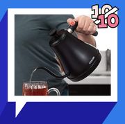 pouring hot water into tea cup from a cosori gooseneck tea kettle