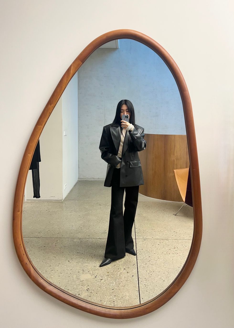 a person taking a selfie in a mirror
