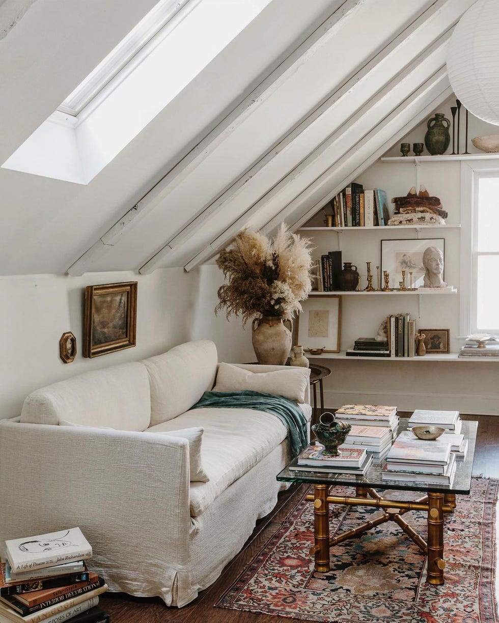 Room with white sofa and bookshelf