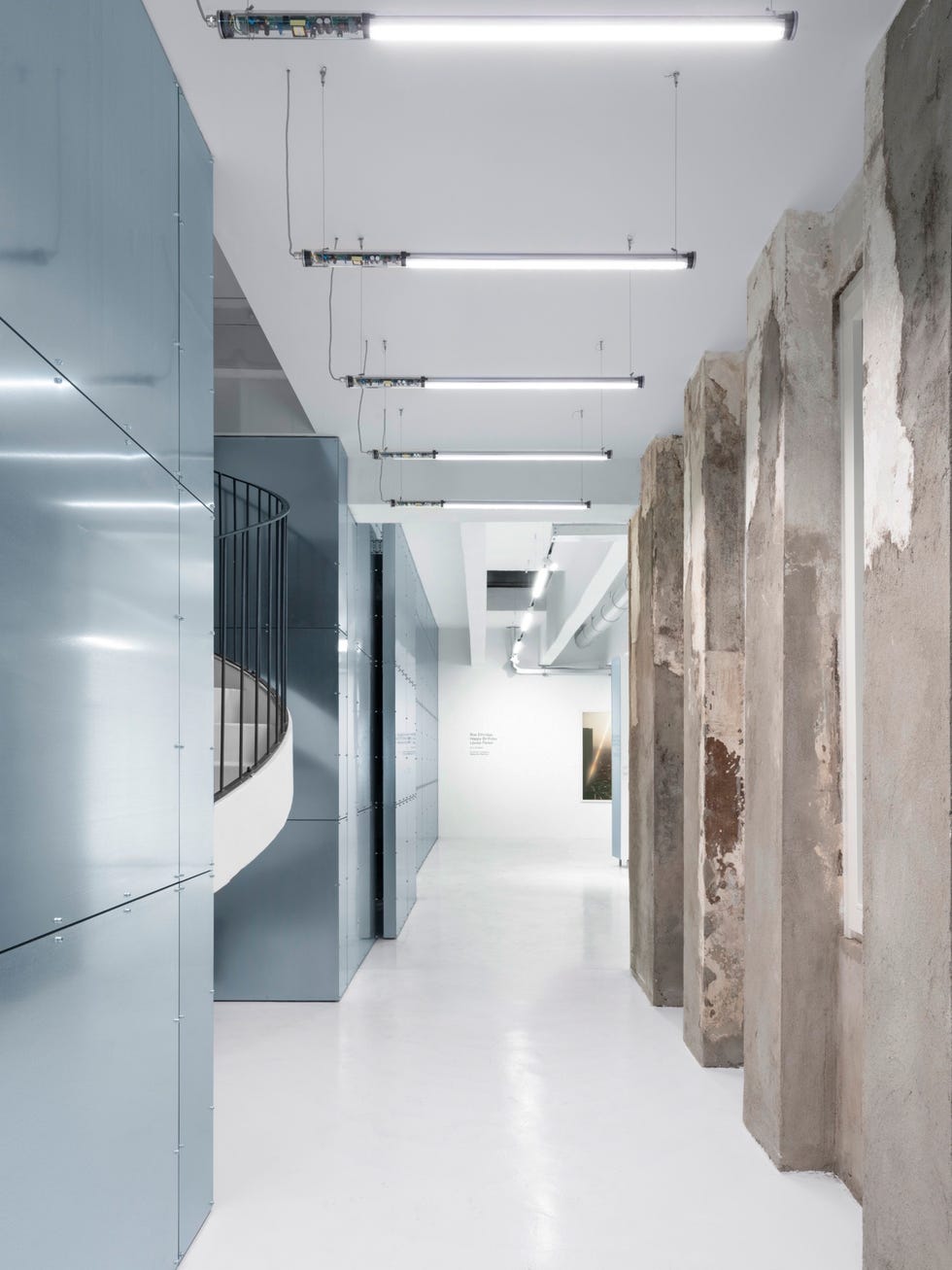 a long hallway with white walls