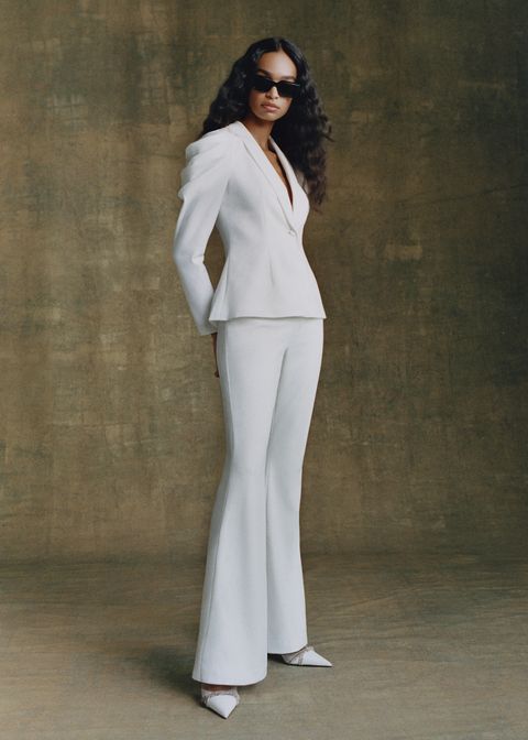 a model wears a carly cushnie suit to illustrate a guide to carly cushnie for bhldn