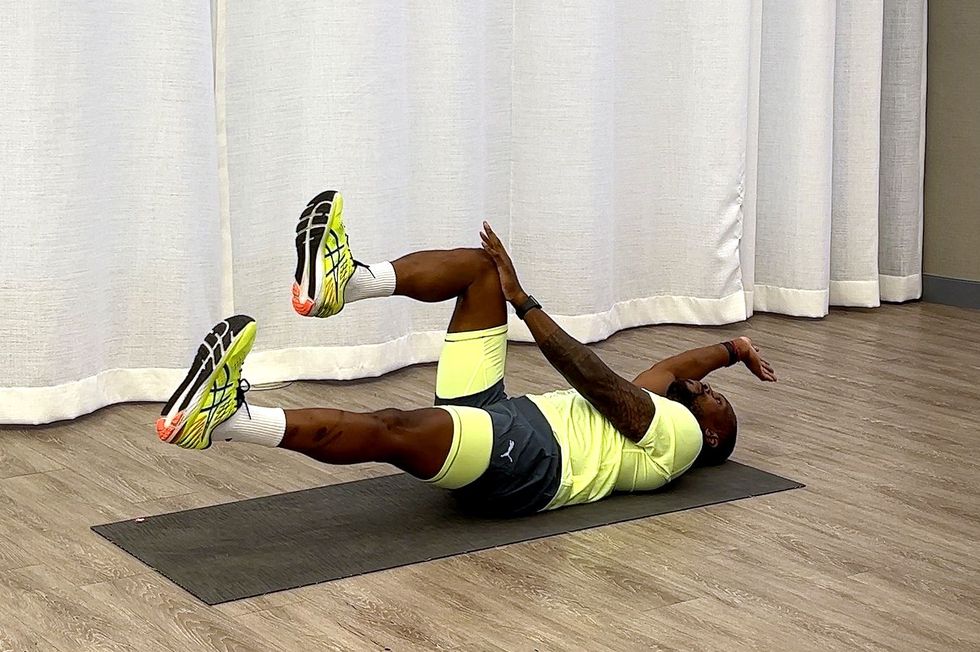 10minute core workout, yusuf jeffers practicing dead bug variation exercise