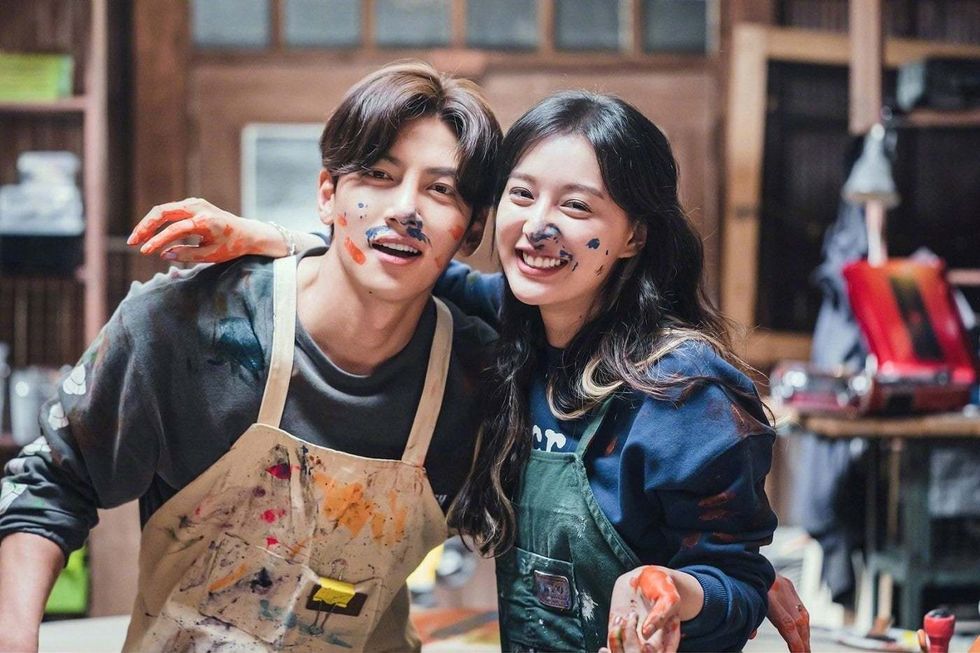 a woman and a boy with paint on their faces