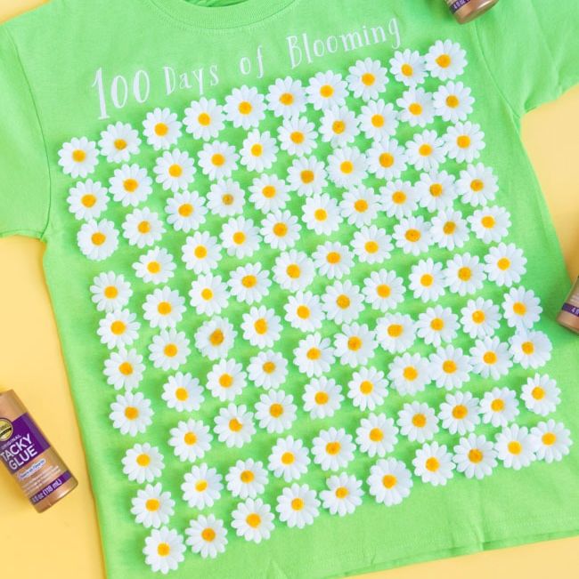 a shirt that says "100 days of blooming" with 100 fake flowers on it