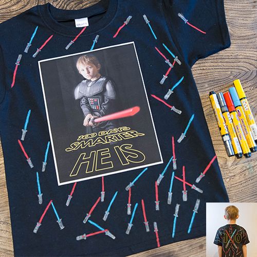a shirt with 100 lightsabers and a picture that says "100 days smarter he is" to celebrate the 100th day of school