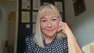 a photo of gill mulroe at her desk.