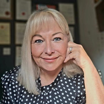a photo of gill mulroe at her desk. a photo of gill mulroe at her desk.