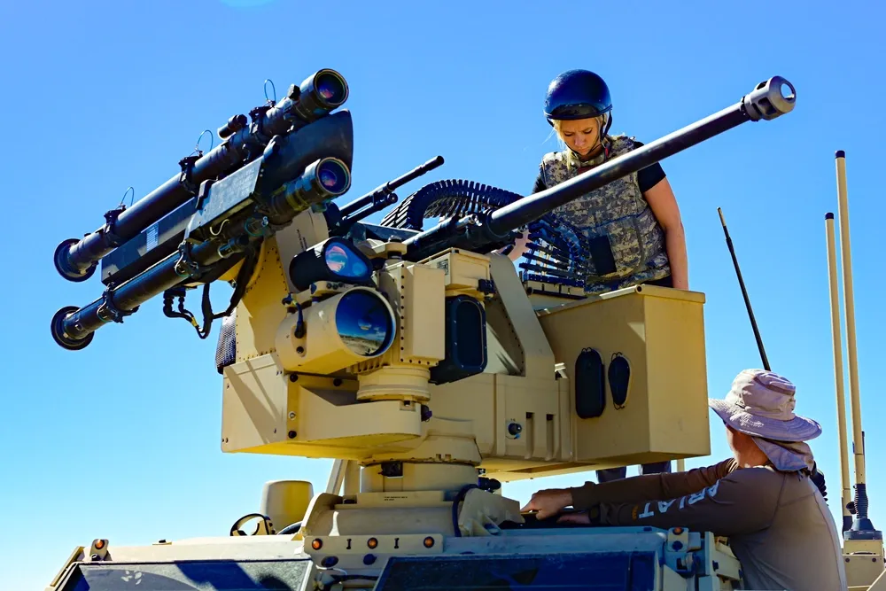 katelyn montrief, left, and micah martin, both human factors engineers of naval surface warfare center, dahlgren division, engage in egress testing on a marine air defense integrated system mk 1 to assess its safety, usability, and physical accommodation during a system integration test at yuma proving grounds in yuma, arizona