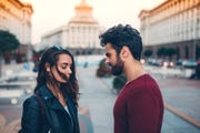 man and woman arguing at the street