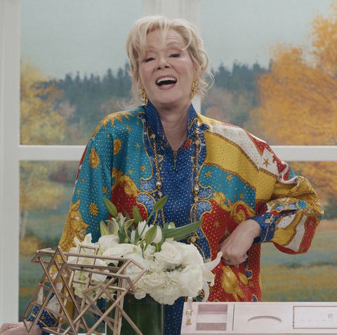 jean smart in a multicolored blouse on set of her new show hacks