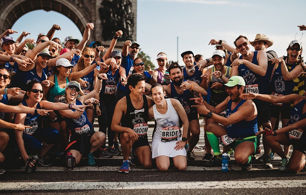 Hughes and Tse with their wedding guests at Brooklyn Half 