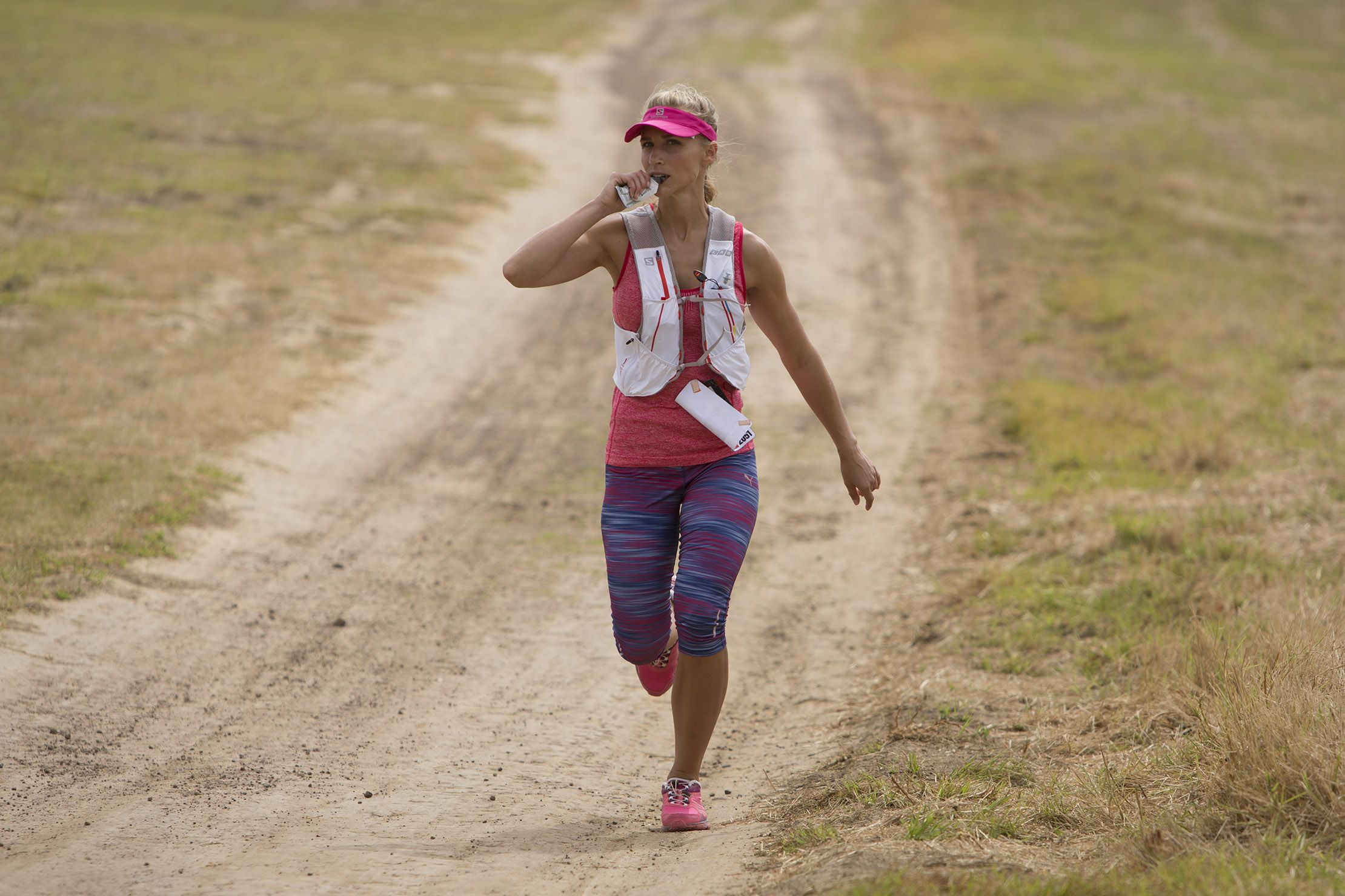 Runner ingesting a gel during a long run.
