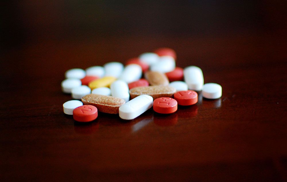 Pills on dark background.