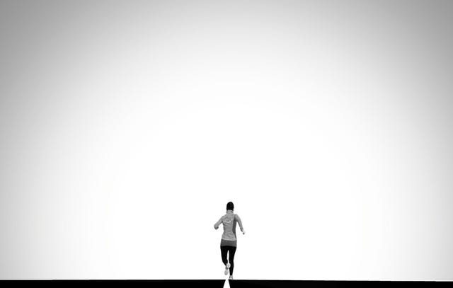 woman running down a road