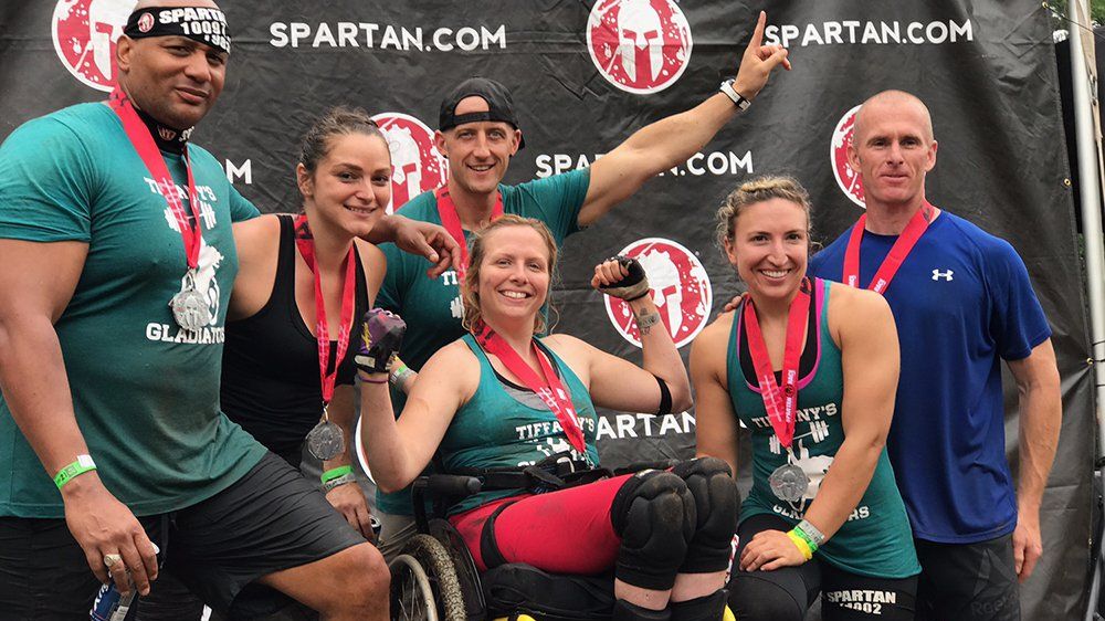 preview for Newswire: CrossFit Team Helps Woman With Rare Disease Complete Spartan Race