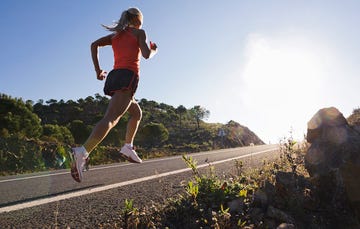 Woman running up hill