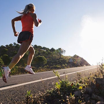 Woman running up hill Woman running up hill