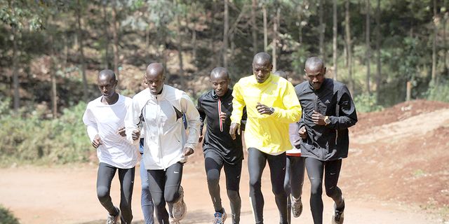 Kenyan runners training in full sweats