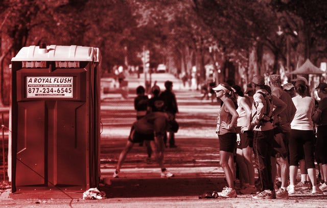 Runners line up at the only Porta Potty on the route