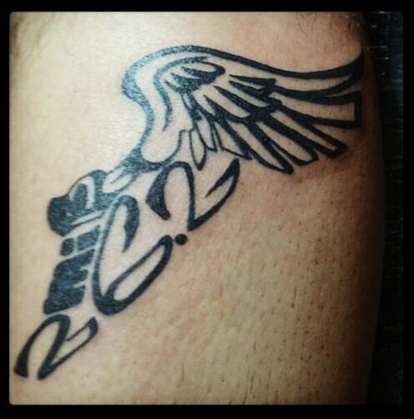 winged track foot tattoo