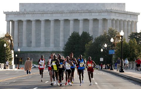 Runners in front of a monument