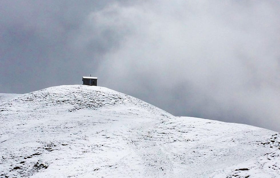 Photo of a house in the swiss alps