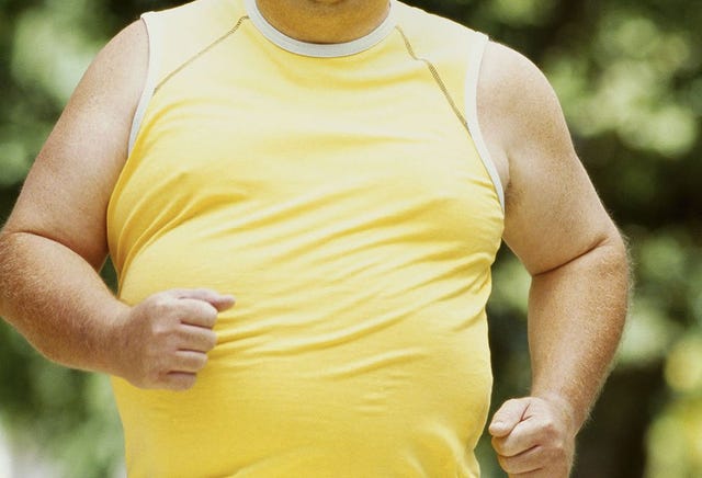 Overweight man exercising
