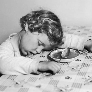 Child asleep at the dinner table Child asleep at the dinner table