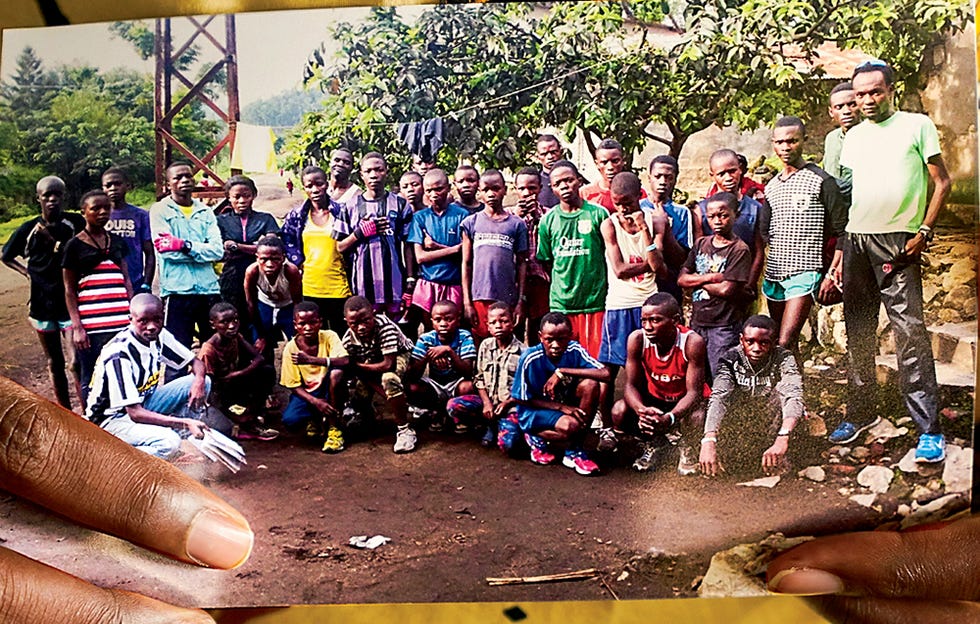 hero long-distance savior makorobondo "dee" salukombo with photo of running students