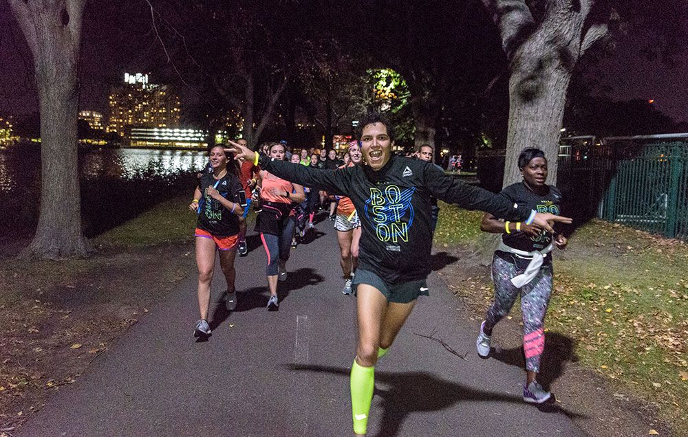 Midnight Runners Crew Over Boston Neon Lights, Techno Music, Sudden Planking | Runner's World