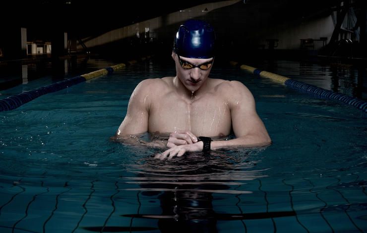 swimmer checking his heart rate