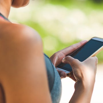 Runner using her phone Runner using her phone