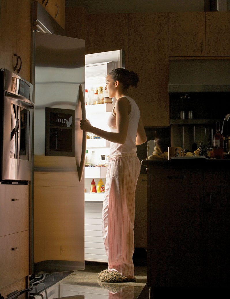 Woman eating late at night.