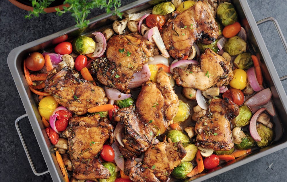 Roasting pan with veggies and chicken