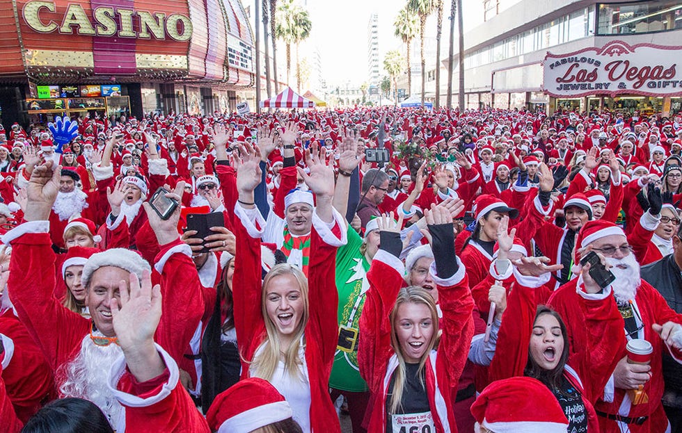 Santa Run participants after the race enjoying entertainment Santa Run participants after the race enjoying entertainment