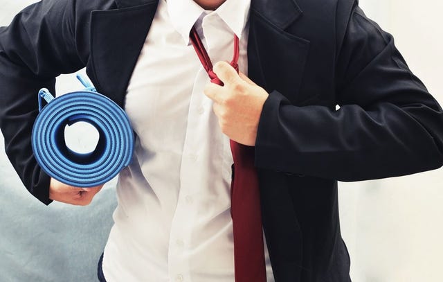 guy with suit and yoga mat