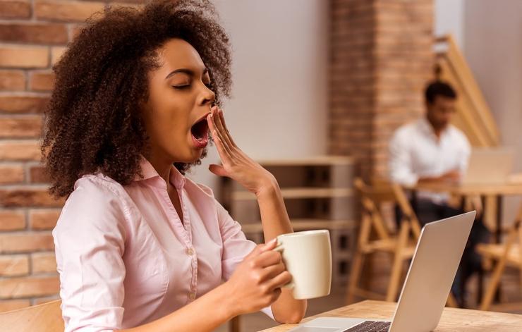 Yawning coffee drinker
